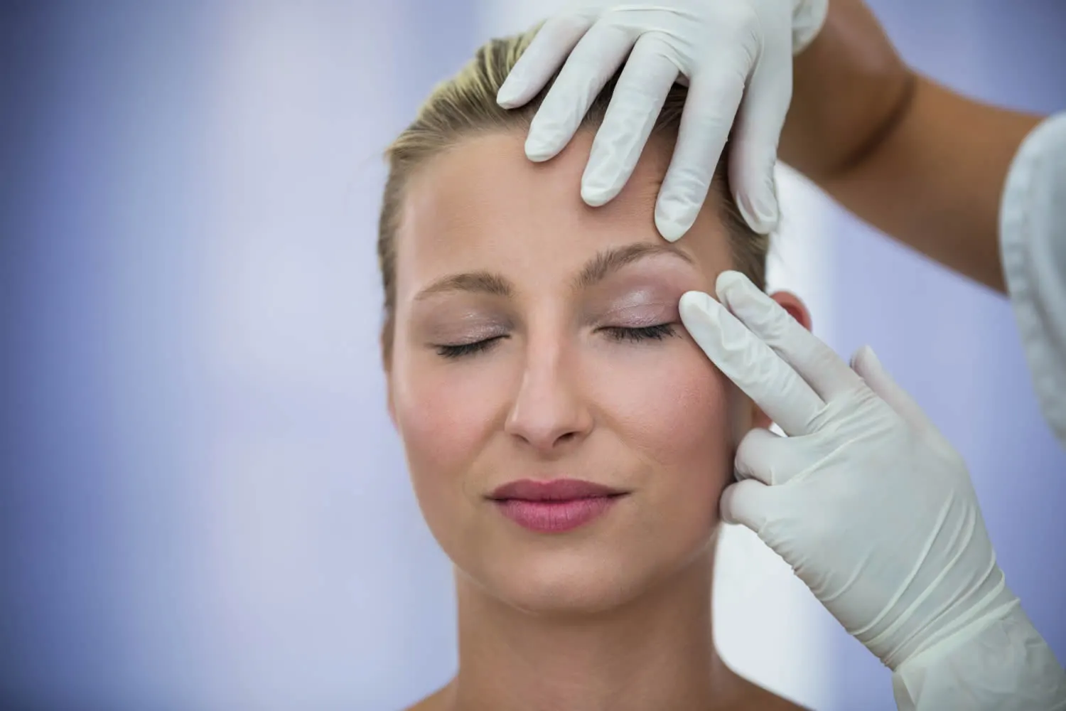medical dermatology woman dermatologist-examining-female-patients-face-from-thermage-treatment